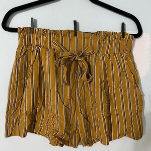 These are FashionNova striped mustard color shorts!